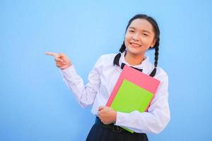 Happy school with book on blue background. photo