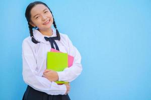 Happy school with book on blue background. photo