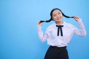 School girl on blue background. photo