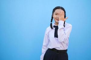 School girl on blue background. photo