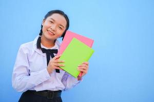 Happy school with book on blue background. photo