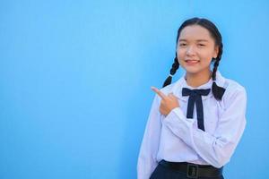 School girl on blue background. photo