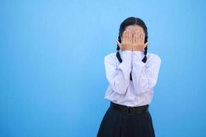 School girl on blue background. photo