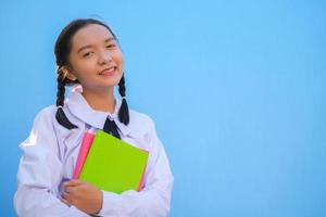 Happy school with book on blue background. photo