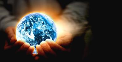Hand hold world globe for eco environment protection and save blue planet from global warming with care business health care and technology photo