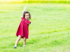 Young children play and learn outside of school to enjoy themselves in the nature park photo