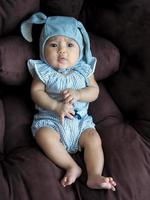 Baby Asian girl dress up in cute fashion dresses for newborn babies photo