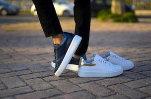 Girl on the street with sports shoes in spring time photo