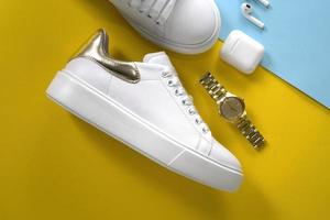 Women's white sports shoes with accessories