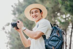 Portrait of young Asian man traveling photo