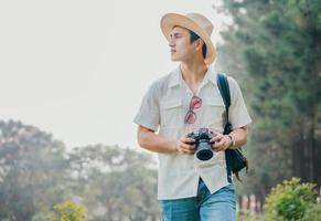 Portrait of young Asian man traveling photo