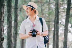 Portrait of young Asian man traveling photo