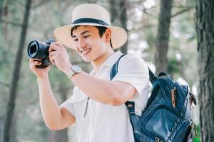 Portrait of young Asian man traveling photo