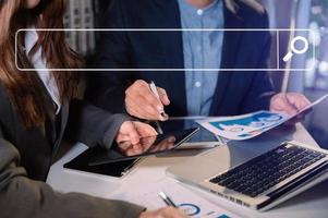 Searching Browsing Internet Data Information Networking Concept. two businessman hand using smart phone,mobile and tablet photo