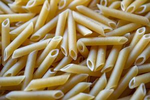 uncooked macaroni pasta, italian food photo