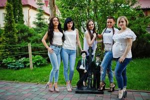 Girls having fun while posing outside in the park on the bachelorette party. photo