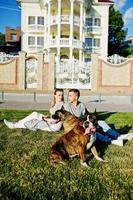 Couple in love with two dogs pit bull terrier on a walk. photo