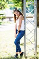 Close-up portrait of a fantastic young model girl posing in the park on a sunny day. photo