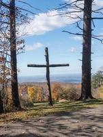 Wooden cross overlooking fall trees near Uniontown, Pennsylvania