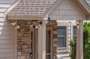 Multiple cameras and sensors securing front door of home photo