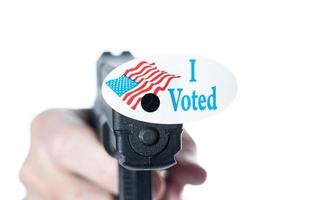 I voted today campaign button with hole on handgun for voter suppression photo