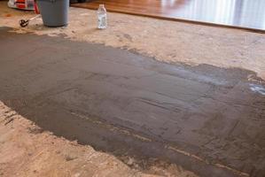 Repair of sub floor boards before laying hardwood in room photo