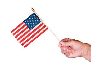 Senior man hand holding a small USA flag isolated against white photo