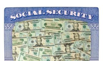 Many US dollar bills or notes inside Social Security framework as concept for funding crisis photo