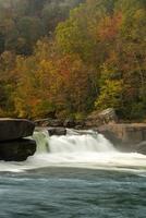 Cascades of the Valley Falls on a misty autumn day photo