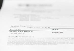 Printout showing result of PCR test for Covid-19 as negative photo