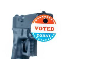 I voted today campaign button with hole on handgun for voter suppression photo