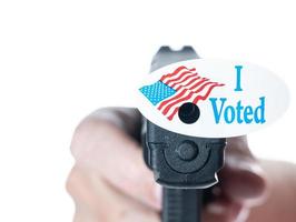 I voted today campaign button with hole on handgun for voter suppression photo