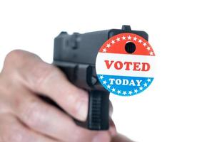 I voted today campaign button with hole on handgun for voter suppression photo