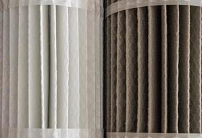 Clean and dirty HVAC filters side by side to illustrate the dfifference