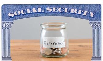 Loose change inside glass jar to represent retirement savings for Social Security photo