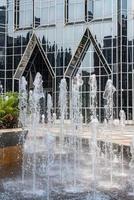Frozen water of fountain by modern futuristic architecture in downtown Pittsburgh