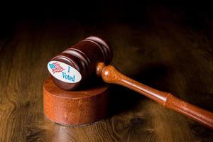 I voted campaign button or sticker with a gavel and mallet to illustrate lawsuits about voting photo