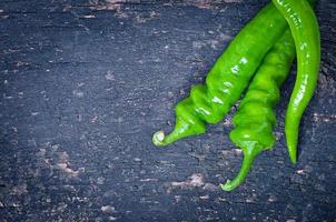 Green chili peppers on  background photo