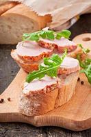 Ham sandwich decorated leaf arugula photo