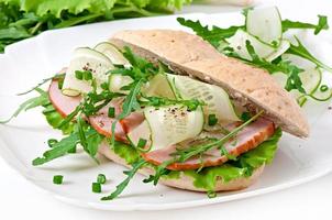 Useful sandwich with ham and herbs photo