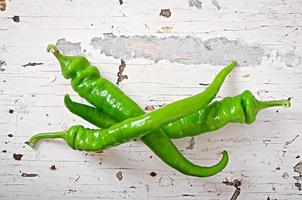 Green chili peppers on  background photo