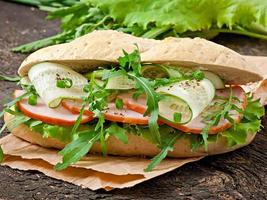Useful sandwich with ham and herbs photo