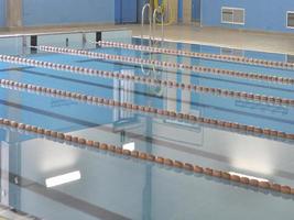 A swimming pool with blue water waves photo