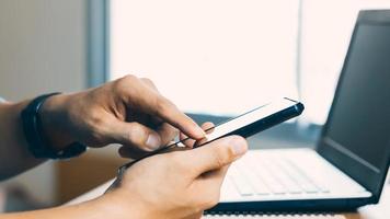 Close-up male hands with smartphone. photo