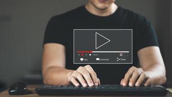 Human hands use laptops in the morning, to watch online streaming, watch video on the Internet, watch live concerts, shows or online lessons. There is sunshine in the morning. photo