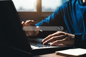 Searching Browsing Internet Data Information with blank search bar.businessman working with smart phone, tablet and laptop computer on desk in office. Networking Concept. photo