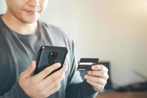 businessmen use their credit cards through mobile internet banking apps to shop online and digital payment ideas. photo