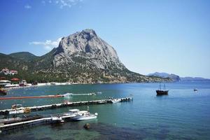 view of the Black Sea and the city of Sudak in Crimea photo