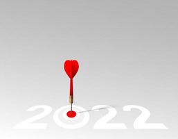 Red dart hit to center of dartboard between number. 2022 New Year with 3d target and goals. Arrow on bullseye in target for new year 2023. Business success, strategy, achievement, purpose concept vector