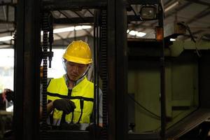 Forklift drivers are drowsy at work because of hard work and little rest. photo